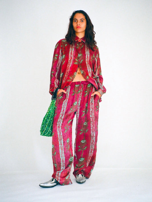 Hand printed silk trousers with large roses