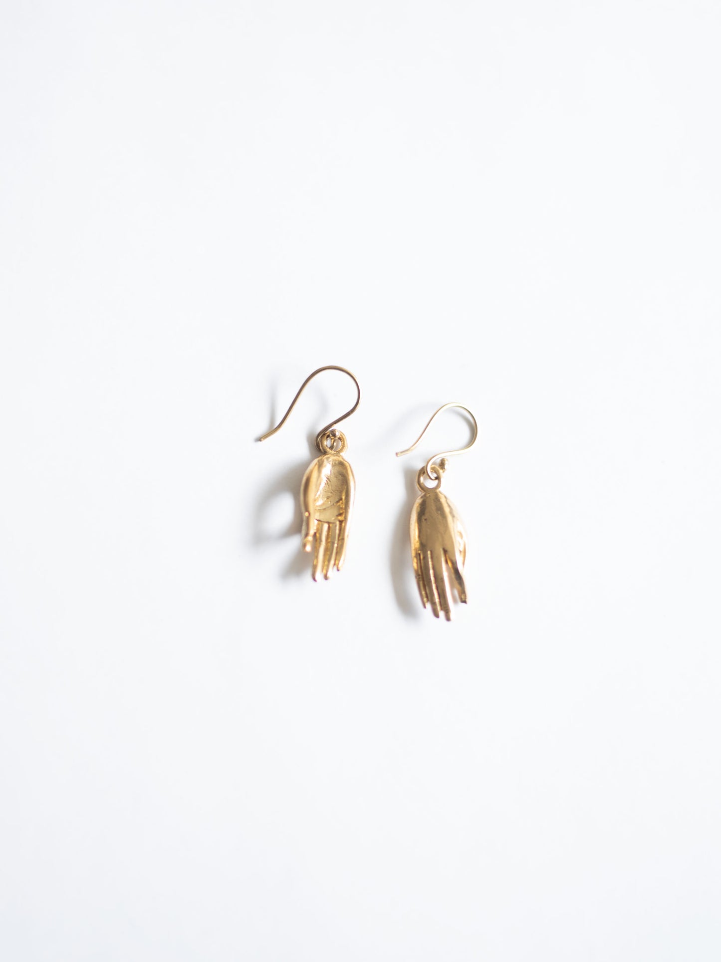 Brass hand earrings