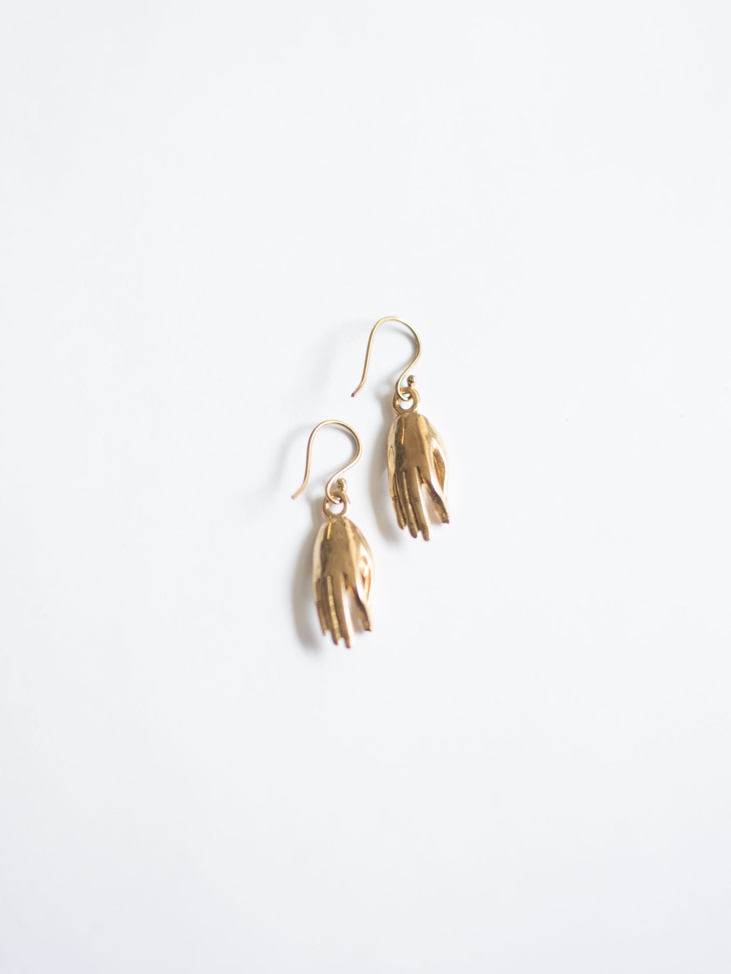 Brass hand earrings