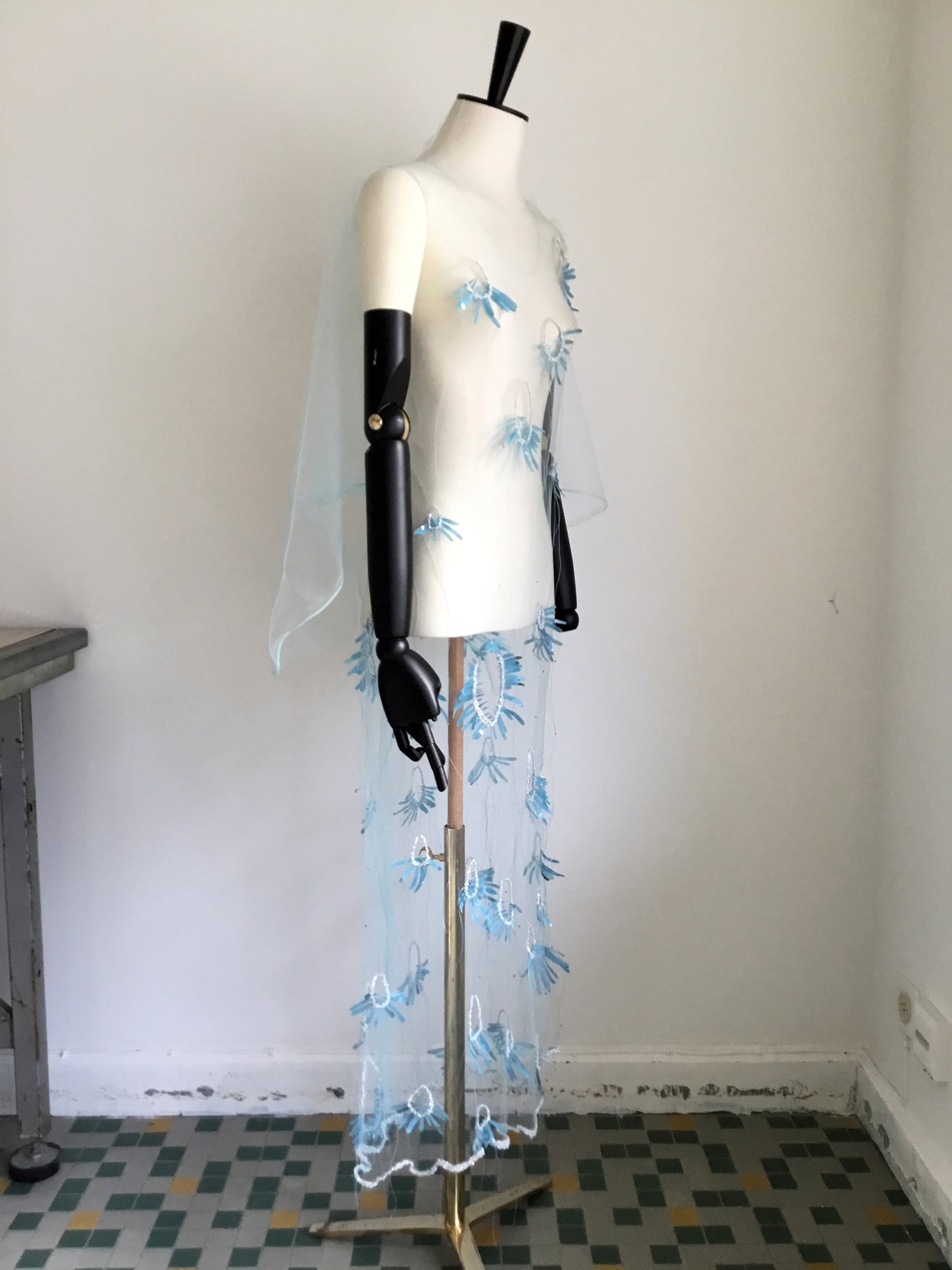 Blue mosquito net dress with reflective flower embroidery